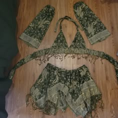 Best fits: - cup size: A-C - skirt: waist 27 - 36 inch (DM for other sizes) - shortest part of skirt: 8 inches long - longest part of skirt: 17 inches long This set includes: crop top, sleeves, hood, and fairy skirt Handmade by me <3 Made to Order, ready to ship in 3-5 weeks DM for other colors! If you're interested in a different style top or skirt, or want to add sleeves or a garter! #handmade #fae #festival #fairy #rave Fairy Two Piece Set, Pashima Scarf Rave, Mushroom Fairy Rave Outfit, Bohemian Halter Top For Party, Bohemian Halter Top For Beach Party, Fitted Green Sets For Festival, Green Fitted Bohemian Set, Bohemian Party Sets For Festivals, Bohemian Fitted Party Sets