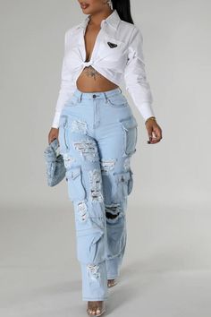 Take on new challenges with our High Rise Multi Pockets Distressed Cargo Jeans! Complete with a high rise waist and multiple pockets, these jeans are perfect for the risk-taker in you. Featuring a distressed design, they add a touch of adventure to any outfit. Ready to conquer the day ahead? These jeans have got you covered. High Rise -Light Blue Washed -Distressed -Multi Pockets -Cargo Jeans -Stretch Denim Fabric Contents 98% COTTON, 2%SPANDEX Spring Ripped Blue Cargo Jeans, Ripped Blue Straight Leg Cargo Jeans, Blue Ripped Cotton Cargo Jeans, Trendy Ripped Blue Cargo Jeans, Trendy Blue Ripped Cargo Jeans, Baggy Ripped Denim Blue Cargo Jeans, High Rise Ripped Blue Cargo Jeans, Spring Ripped Cargo Jeans In Denim Blue, Ripped Denim Blue Cargo Jeans For Spring