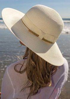 Our Charlene is gorgeous, elegant, and stylish. Enjoy carefree summer days with this sweet women's sun hat. The lightweight summer styling is enhanced with a contrasting gold shimmery ribbon band that wraps the crown and the brim's edge. A back bow provides a feminine accent. The rich cream and gold colors dress up any outfit and are sure to be a hit on the beach or just for some really great street style. The wide brim can be adjusted upwards or downwards, per your preference. We love how it pr Gold Color Dresses, Raffia Sun Hat, Dressy Hats, Large Brim Hat, Footprints In The Sand, Cream Fashion, Summer Straw Hat, Womens Hat, Summer Hats For Women