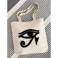 This embroidered tote bag patterned Eye of Horus is a Egyptian god in Egyptian mythology. You can use custom embroidered patch for tote shoulder bag, tote bag for school or book tote bag. Punch Needle tote bag purse is cute Christmas gift for her. I have designed these top quality personalized punch needle embroidered tote bags for you.🌸  You can also create your canvas shopping bag how you want. 🍃Main Frame - 100% Cotton (Eco friendly) 🍃Dimension - 14'' x 16'' ( 35cmx40cm) 🍃Yarn - %100 cott Canvas Shoulder Bag With Embroidered Logo, White Rectangular Shoulder Bag With Embroidered Logo, Everyday Embroidered Rectangular Bag, Beige Bags With Embroidered Logo For Daily Use, Embroidered Canvas Bags For Daily Use, Canvas Shoulder Bag With Embroidered Logo And Rectangular Shape, White Tote Shoulder Bag With Embroidered Logo, Daily Use Embroidered Canvas Bags, Rectangular Shoulder Bag With Embroidered Logo For Daily Use