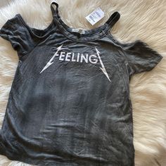 For All The Rocker Girls Out There! Grab This Cold Shoulder Tee With The Cool Feelingz Graphic Dead Center! Nwt, Never Worn Brand: Charlotte Russe Size: Xs Trendy Graphic Print Tops For Music Festival, Trendy Crew Neck Tops For Music Festival, Grunge Tops For Summer Music Festival, Summer Grunge Tops For Music Festival, Spring Streetwear Grunge Tops, Spring Grunge Streetwear Tops, Summer Music Festival Grunge Tops, Summer Band Merch Tops Relaxed Fit, Summer Band Merch Tops With Slogan