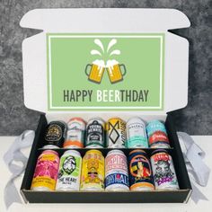 an open beer gift box filled with lots of different types of beers and the words happy birthday