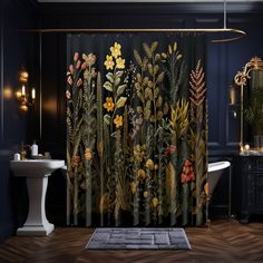 a bath room with a tub and a shower curtain that has flowers on the side