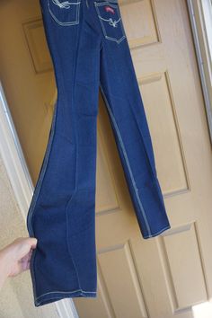 "This is a great pair of vintage Rene De France jeans. The Jeans have great contrasting stitching that really stands out against the blue denim and uniquely shaped backside. Labeled size 32 - 11 - please see measurements. Measurements taken across front laid flat Size Marked: 32 - 11 Waist: 14.5\" Hips: 20\" Inseam: 34\" Rise: 11\"" Mid-rise Flare Jeans With Contrast Stitching In Medium Wash, Fitted Dark Wash Flare Jeans With Contrast Stitching, High Rise Blue Flare Jeans With Contrast Stitching, Fitted Denim Blue Bottoms With Contrast Stitching, Mid-rise Dark Wash Pants With Contrast Stitching, Fitted Denim Blue Pants With Contrast Stitching, Mid-rise Blue Flare Jeans With Contrast Stitching, High Rise Dark Wash Flare Jeans With Seam Detailing, Blue Mid-rise Flare Jeans With Contrast Stitching