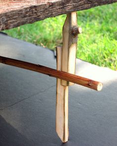 a piece of wood sitting on top of a wooden bench