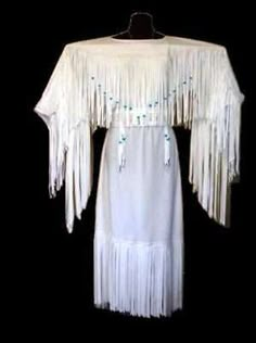 Accents: Fringes. Outer Shell Material: Grade 'A' Real Cowhide Leather. Sewing Thread: Heavy-duty top-stitching strong thread. Wear: Maxi, Jacket Coat, Dress. Colour: White. Seasons: Fall, Spring & Winter. Native American Wedding Dress, Buckskin Dress, American Wedding Dress, American Indian Clothing, Native Clothing, Native Beauty, American Dresses, Native American Wedding, Native American Dress