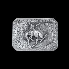 Featuring an immaculate centennial bronc figure set over phenomenal hand engraving, this trophy buckle is an elegant piece fit for any belt. This buckle is a channel style so there is an engraved lip on the top and bottom edges making it three-sided, giving the leather strap a "channel" to pass through, and measures 1 5/8" in height and 2 1/2" across. See our Vogt belt collection to find the perfect match for this buckle. All Vogt sterling items come with the Vogt Family's Unconditional Lifetime Western Engraved Belt For Formal Occasions, Western Style Engraved Belt For Formal Occasions, Elegant Hand Tooled Belt Buckles For Formal Occasions, Elegant Hand Tooled Belt Buckles For Formal Wear, Elegant Formal Hand-tooled Belt Buckles, Classic Concho Belt Buckles For Rodeo, Western Style Antique Belt Buckle For Formal Wear, Western Style Antique Belt Buckle For Formal Occasion, Classic Silver Hand-tooled Belt Buckle