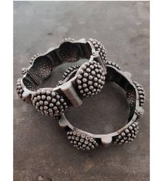 "\"Grab this beautiful black polish Kada and match it with any of the ethnic/ Indo western outfits, and look unique in crowd. This Kada/bracelet combines intricate detailing in a geometric line motif and contemporary design to help you make heads turn. The technique of oxidization has been used to give a dull sheen and bring out the exquisite design. This beautiful German silver bracelet is free of lead and nickel. These gorgeous pieces won't cause any skin rash or irritation. This bracelet is o Traditional Oxidized Bangle, Festive Fusion Metal Bracelets, Heavy Bohemian Bracelets For Diwali, Metal Bracelets With Latkans For Festival, Festive Bangle With Oxidized Finish, Bohemian Heavy Bangle For Diwali, Bohemian Bracelets For Diwali Ceremonial, Bohemian Bracelets With Motifs For Diwali, Bohemian Handmade Bangle For Navratri