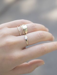 This ring is perfect to pair with any outfit and with a personalized touch by engraving the top of the ring with your first initial. We love wearing this ring on our index finger, a staple ring that goes beyond the trend of the moment. Timeless Open Initial Ring For Promise, White Gold Stackable Oval Rings, Dainty Oval Stackable Signet Ring, Stackable Open Signet Ring In Rose Gold, Rose Gold Stackable Open Signet Ring, 14k Gold Dainty Initial Ring With Polished Finish, Classic White Gold Initial Ring For Everyday, Stackable Open Rose Gold Signet Ring, Stackable Rose Gold Open Signet Ring