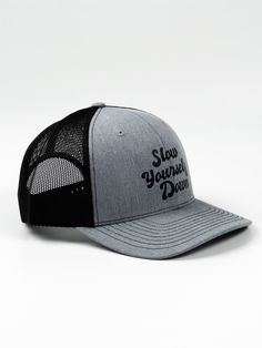 Crafted for a snug fit, classic trucker hat mesh, and snapback adjustment, this versatile hat lets you switch up your style effortlessly. Choose from the retro Slow Yourself Down logo, a breezy palm tree, or the Sun Dip logo. SIZING: One Size Fits Most (7 – 7 3/4) Trucker Hat With Curved Visor For Baseball Season, Gray Adjustable Snapback Trucker Hat, Adjustable Trucker Hat With Letter Print And Curved Bill, Adjustable Trucker Hat For Baseball Season With Curved Visor, Adjustable Mesh Trucker Hat With Curved Visor, Adjustable Trucker Hat With Curved Visor, Adjustable Mesh Snapback Hat With Curved Visor, Gray Trucker Snapback Hat With Curved Bill, Adjustable Gray Trucker Hat With Curved Bill