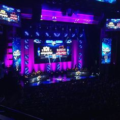 the stage is lit up with purple lighting