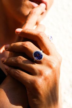 a close up of a person wearing a ring