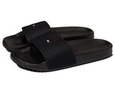 Tommy Hilfiger Roldez - Men's Shoes : Black : The Tommy Hilfiger Roldez slides offers a sleek and stylish look. Man-made upper. Man-made lining and insole. Slide-on construction. Brand logo on the strap girth. Man-made outsole. Imported. Measurements: Weight: 6 oz Product measurements were taken using size 10, width D - Medium. Please note that measurements may vary by size. Weight of footwear is based on a single item, not a pair. Classic Synthetic Slides With Textured Footbed, Classic Cushioned Slip-on Slides, Classic Cushioned Slides, Classic Synthetic Slides With Removable Insole, Classic Black Slides With Rubber Sole, Classic Synthetic Slides With Branded Insole, Casual Black Tommy Hilfiger Sandals, Classic Slip-on Synthetic Slides, Classic Synthetic Slip-on Slides