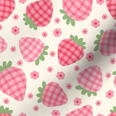 a pink and white checkered fabric with strawberries on it