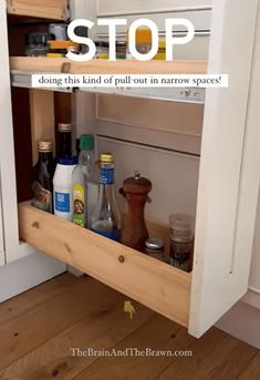 the bottom shelf of a kitchen cabinet is full of spices and condiments, with text overlay reading stop doing this kind of pull out in narrow space