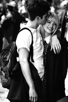 black and white photograph of two people hugging each other