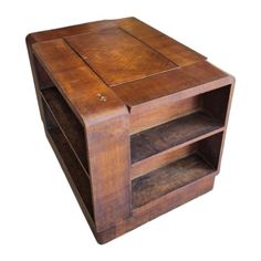 a wooden table with two open shelves on each side