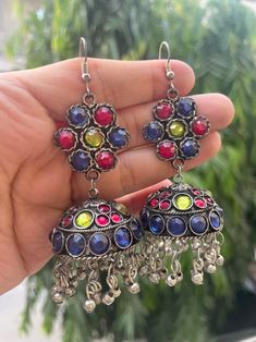 Exude the classic desi girl style with these boho multicoloured stone jhumkas.  Channel your inner Bollywood diva with these antique earrings that are the perfect with both Indian and western outfits. Styling your Kurtis and sarees has never been easier when you have these beautiful earrings in your jewellery collection.  In case of any queries, please feel free to contact us. Happy shopping! Multicolor Temple Jewelry Jhumkas For Celebration, Multicolor Dual-tone Earrings For Festivals, Multicolor Temple Jewelry Jhumkas For Festivals, Traditional Multicolor Dual-tone Earrings, Festive Multicolor Temple Jewelry Jhumkas, Multicolor Temple Jewelry Jhumkas For Festive Occasions, Multicolor Oxidized Temple Jewelry Earrings, Multicolor Fusion Style Festive Jhumkas, Multicolor Round Temple Jewelry Danglers