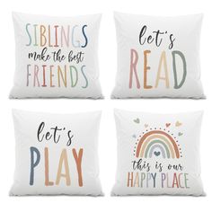 four pillows with sayings on them in different colors and styles, one says let's read, the other says let's play