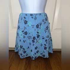 Brand: Wild Fable Color: Blue With Dark Blue And Green Flowers Size:Small Condition:New With Tags Blue Floral Print Skort For Spring, Light Blue Casual Skirt With Floral Print, Casual Blue Floral Print Mini Skirt, Light Blue Floral Print Casual Skirt, Casual Light Blue Floral Print Skirt, Blue Relaxed Fit Mini Skirt With Floral Print, Blue Skort For Spring, Blue Floral Print Relaxed Mini Skirt, Blue Floral Print Relaxed Fit Mini Skirt