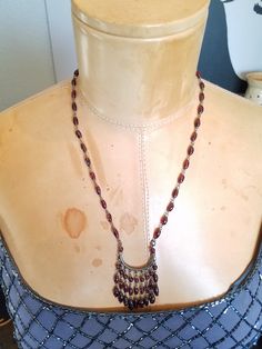 "This vintage Czech Bohemian Glass Beaded Necklace is made using Sterling Silver Wire with hand wire-wrapped Purple Rice Shaped Glass Beads, Reminds me of a Rosary beads. The beads are cold to the touch indicating they are Amethyst. A U tube with 9 wire stations to hold the beaded fringes is suspended on 2 beaded chains. It's the perfect Bib necklace because the color purple matches any outfit. I replaced the clasp with a modern bronze lobster clasp. It will arrive in a gift box with FREE SHIPPI Bohemian Purple Beaded Necklace With Faceted Beads, Bohemian Purple Beaded Necklaces With Czech Glass, Purple Bohemian Beaded Chain Necklace, Bohemian Purple Beaded Chain Necklace, Beaded Necklace Purple, Bohemian Czech Glass Beaded Necklace Hand-strung, Purple Rice, U Tube, Rice Bead