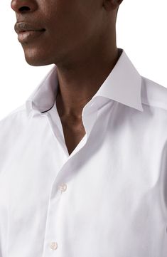 Cut in a slim fit, this sharp dress shirt is constructed from high-performance, crease-resistant cotton and fitted with a classic spread collar. 32" length; 45" chest (size 16.5) French placket Spread collar Mitered, adjustable button cuffs Darts at the back to adjust the width Curved hem 100% cotton Dry clean or machine wash, line dry Imported Elegant Slim Fit Cotton Dress Shirt, Office Wear Spread Collar Dress Shirt With Button Closure, Cotton Dress Shirt With Spread Collar For Office, Fitted Cotton Shirt With Wrinkle-resistant Finish, Fitted Cotton Shirt With Wrinkle-resistant Feature, Elegant Cotton Dress Shirt With Spread Collar, Fitted Wrinkle-resistant Cotton Shirt, Wrinkle-resistant Fitted Cotton Shirt, Elegant Cotton Dress Shirt