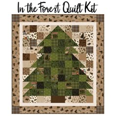 a quilted christmas tree with the words in the forest quilt kit