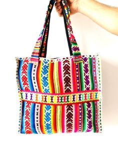 This bag was produced from the recycled handmade traditional fabric of the Andean highlands. It has black lining inside with a pocket. Measurements:  Height: 13 inches (34 cm). Flat width: 14.5 inches (37 cm). Depth/Gusset: 6.3 inches (16 centimeters). Handle length: 25 inches (65 cm). Artisan Bags With Weaving Work For Everyday Use, Large Multicolor Shoulder Bag For Daily Use, Everyday Shoulder Bag With Weaving Work, Everyday Weaving Work Shoulder Bag, Artisan Multicolor Rectangular Hobo Bag, Multicolor Woven Shoulder Bag, Festival Cotton Tote Shoulder Bag, Vintage Multicolor Satchel For Everyday, Vintage Multicolor Everyday Satchel