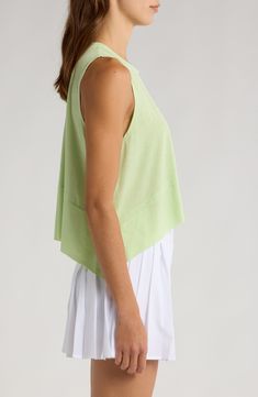 A classic addition to your workout collection, this muscle tee is cut from a soft and stretchy blend that feels breezy and light. 20" length (size Medium) Crewneck Sleeveless 90% polyester, 10% elastane Machine wash, dry flat By Free People; imported Stretch Athleisure Tops For Summer, Summer Crew Neck Top For Layering, Summer Stretch Athleisure Tops, Sporty Sleeveless Tops For Spring, Spring Athleisure Short Sleeve Muscle Tee, Spring Crew Neck Activewear For Layering, Spring Layering Activewear With Crew Neck, Green Athleisure Tops For Workout, Athleisure Relaxed Fit Tops For Layering