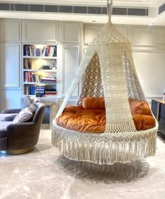 a living room filled with furniture and bookshelves