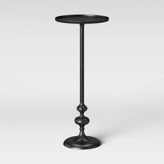 a small black table with a metal base