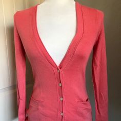 Banana Republic Coral Cardigan. Size Xs Nwt 52% Silk 13% Cotton 35% Polyester Deconstructed Seaming With Ribbed And Pointelle Trim Length From Top Of Shoulder Seam 24” Sleeve Length From Shoulder Seam 23” Bust 28” Stretches To 38” Waist 24” Stretches To 39” Sweep 28” Stretches To 40” Fitted Button-up Cardigan With Pockets, Fitted Button-up Sweater With Pockets, Fitted Sweater With Button Closure For Spring, Trendy Fitted Cotton Cardigan, Fitted Sweater For Spring Daywear, Classic Spring Sweater With Pockets, Fitted Button-up Spring Cardigan, Fitted V-neck Outerwear For Day Out, Fitted V-neck Cardigan With Pockets