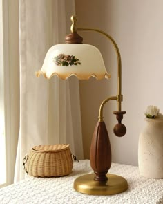 The classic retro design, with its elegant curved arms and wavy edge lampshade complementing each other, exudes a nostalgic warmth. The combination of gold and wood elements not only provides warm lighting, but also adds a unique decorative effect. It is very suitable for living rooms, study rooms or bedrooms, adding a classic and elegant atmosphere to the interior space. Light Source One 40 watt maximum medium (E26 or E27) bulb required. (Not included bulbs) Dimmable with compatible dimming bul Room Decor Items Bedrooms, Vintage Lamp Aesthetic, Retro Lamps Vintage, Fairy Lamps Vintage, Cute Lamps For Bedrooms, Hope Box, Vintage Lampshades, Side Table Lamp, Crystal Chandelier Kitchen