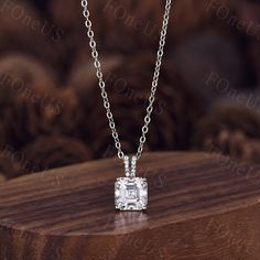 Here we have a 7mm asscher cut Moissanite necklace sterling silver moissanite necklace for women vintage unique solitaire pendant bridal wedding jewelry. This is the perfect gift for mom, wife, fiancee, girlfriend, valentine, daughter, family or friend. It is a special gift for mother's day, valentine's day, wedding, anniversary, birthday, Christmas, Easter, New Year's and any holiday. You can choose if you want 14Kt White Gold, 14Kt Yellow Gold or 14Kt Rose Gold.  Jewelry is handmade by us focu Asscher Cut Solitaire Necklace With Diamond Accents For Anniversary, Emerald Cut Solitaire Necklace In Sterling Silver For Anniversary, Elegant Emerald Cut Solitaire Necklace For Wedding, Emerald Cut Prong Setting Necklace, White Gold Solitaire Necklace For Wedding With Asscher Cut, Wedding Diamond Necklace With Asscher Cut Single Diamonds, Formal Cubic Zirconia Necklace With Asscher Cut, Fine Jewelry In Sterling Silver With Asscher Cut, Emerald Cut Diamond Necklace For Wedding With Prong Setting