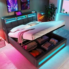 a bed that has some items in the middle of it and is lit up with neon lights