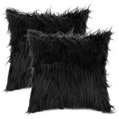 two black furry pillows sitting next to each other