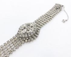 "~ 1950s beautiful & elegant rhinestone bracelet ~ Dimensional oval center ~ Chain guard ~ Silver metal ~ Brighter than photo shows! ~ Excellent Measures- 7.2\" x 1.25\" (18.41 x 3.17 cm) Band width- .50\" (1.27 cm) Additional Vintage Jewelry in our sister shop Glenna's Jewels: http://glennasjewels.etsy.com More Incredible Vintage: http://glennasvintageshop.etsy.com Instagram @glennas_clothing Facebook https://www.facebook.com/glennasclothing" Vintage Oval Rhinestone Jewelry, 1950’s Dress, Rhinestone Bracelet, Green Enamel, Rhinestone Necklace, Vintage Rhinestone, Arm Band, Cuff Bracelet, Clip On Earrings