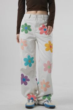 These High Waisted Jeans with Flowers bring a unique style to any wardrobe. With a loose fit featuring wide legs. pockets. and belt loops. you'll stay comfortable all day. The flowers and high waisted cut offer a fun. feminine look no matter the occasion.Fabric: Cotton. Polyester Paint On White Jeans, High-waisted Floral Wide Leg Pants For Spring, Spring Floral Print High-waisted Wide Leg Pants, Spring Floral Print Wide Leg Pants, Spring Floral Print Wide Leg Bottoms, Spring Floral Print High Waist Wide Leg Pants, Retro Wide Leg Pants With Floral Print, Retro Floral Print Bottoms For Spring, Retro Bottoms With Floral Print For Day Out