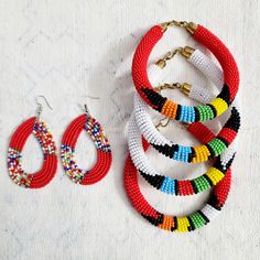 These beautiful Maasai beaded Earrings will make you look your very best wherever you go. Beautiful, hand beaded earrings are handmade by Maasai women artisan in Kenya These traditional earrings have become very popular over the years and can be worn from casual and formal events year round. Note: As with all handcrafted products colours, design patterns and size my very. Note: Bracelet sold separately Handmade in Kenya Drop length: 3 Inches Materials: Maasai beads Closure: Ear wire Handwoven Beaded Bracelets With Round Beads, Festive Beaded Hoop Earrings With Round Beads, Festive Beaded Hoop Earrings, Traditional Beaded Hoop Earrings, Festive Round Beaded Earrings, Traditional Adjustable Beaded Earrings, Traditional Multicolor Beaded Hoop Earrings, Traditional Beaded Dangle Hoop Earrings, Traditional Large Beaded Earrings For Gifts