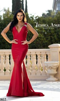 Behold the beauty of this v-neck long mermaid prom dress 803 by Jessica Angel. With a sparkly brooch at one shoulder strap, this deep v-neck long designer dress gets a hint of shimmer with every move at prom, galas, and other black-tie events. In misses and plus sizes, this long formal dress has a horizontal band in the back of the neck that beautifully frames the open v-back, while the hip-skimming long mermaid skirt ends in a sweeping train. Made in the USA, this v-neck long mermaid prom dress Long Mermaid Skirt, Long Mermaid Prom Dresses, Prom Dresses Long Mermaid, Long Formal Dresses, V Neck Prom Dresses, Dresses For Prom, Mermaid Prom Dress, Long Formal Dress, Prom Designs