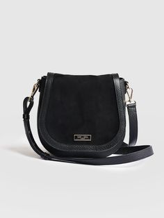 Buy the Saddle Bag in Black. A beautiful all occasion handbag made from 100% natural leather with a soft cotton canvas lining. We only make a few at a time with the finest leather from Italy. From our Women's Leather Bags here at Saint and Sofia. Free Shipping on all orders over $50. Classic Soft Leather Saddle Bag For On-the-go, Chic Shoulder Bag With Suede Lining For Work, Classic Suede Shoulder Bag For Work, Classic Shoulder Bag With Suede Lining For Daily Use, Black Suede Bag With Detachable Strap, Black Leather Bag With Suede Lining, Chic Satchel Flap Bag With Leather Trim, Chic Leather Trim Satchel Flap Bag, Black Saddle Bag With Detachable Strap For Work