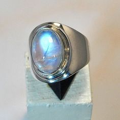 Sterling silver ring with blue moonstone by stoneandsilverfr Moonstone Ring Men, Modern Oval Sterling Silver Moonstone Ring, White Gold Moonstone Cabochon Ring, White Gold Cabochon Moonstone Ring, Modern Silver Moonstone Cabochon Ring, Modern Silver Moonstone Ring With Polished Finish, White Polished Moonstone Ring, Modern Moonstone Ring With Oval Cabochon, Silver Moonstone Ring For Formal Occasions