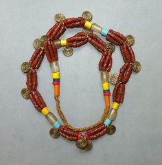 This necklace, strand glass beads and metal pendants originates from the Naga. The hanging length of the strand is 34 cm. The diameter of the beads is 0.4  cm to 0.9 cm. The pendants are 1,5 cm long.  Its weight is 89 gram. (s05) SHIPPING SHIPMENT is FREE. All items are shipped every week on monday morning after receipt of payment. We send priority airmails. Please consider overseas shipments take usually 5 - 8 days. Insured packets (over 50 cm length / over 1500 gram) I send by standard way. PA Metal Pendants, Brass Pendants, Multi Strand Necklace, Metal Pendant, Ethnic Jewelry, Monday Morning, Strand Necklace, Multi Strand, Air Mail