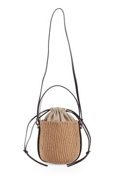 Elevate your warm-weather look with this compact basket bag designed with a drawstring lining and a leather version of the logo-embellished Woody strap. Drawstring closure Top carry handle; crossbody strap Lined Paper straw with leather trim Made in Italy Designer Handbags This brand has B Corp certification, representing business practices with emphasis on social and environmental performance, accountability and transparency This brand meets Nordstrom Responsible Brands criteria: brand adheres Luxury Shoulder Bag With Braided Handles For Spring, Spring Straw Bag With Top Handle And Removable Pouch, Spring Straw Bag With Removable Pouch And Top Handle, Luxury Leather Basket Bucket Bag, Beige Leather Basket Bucket Bag, Luxury Straw Bag With Detachable Handle For Spring, Chic Basket Shoulder Bag With Adjustable Strap, Luxury Spring Straw Bag With Detachable Handle, Luxury Spring Bucket Bag For Daily Use