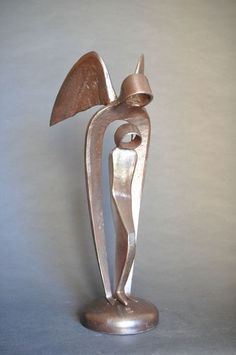 a metal sculpture is shown on a gray background