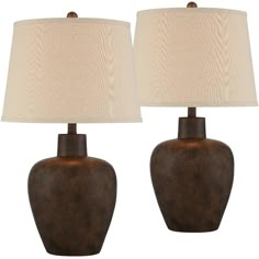 a pair of table lamps with shades on them