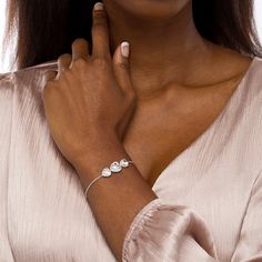 Let your romantic side shine through this darling heart-shaped white lab-created sapphire frames three-stone bolo bracelet in silver. Crafted in sterling silver This look showcases a trio of sideways heart-shaped shimmering white lab-created sapphires - the largest a 9.0mm center stone. Petite lab-created sapphires surround each stone to complete the design. This wheat chain bracelet adjusts up to 9.0 inches in length and secures with a bolo clasp and ball ends. Heart Cut Wedding Jewelry, Elegant Adjustable Heart Bracelet For Mother's Day, Elegant Valentine's Day Heart Bracelet, Elegant Cubic Zirconia Bracelets For Mother's Day, Elegant Heart Bracelet With Cubic Zirconia For Valentine's Day, Adjustable Cubic Zirconia Heart Bracelet For Wedding, Elegant Cubic Zirconia Heart Bracelet For Valentine's Day, Elegant Valentine's Day Heart Bracelet With Cubic Zirconia, Elegant Adjustable Heart Bracelet For Valentine's Day