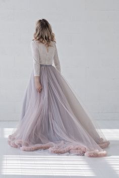 "Default features of this skirt: * It consists 4 tulle layers, fully lined in bridal satin. * Slightly gathered only the outermost layer, inner ones fully flart * Slim A line silhouette. * Non hand dyeable, but a vast color selection available. * Lining in half circle, wide and flowing. * Features a default train of 22\" or 55cm, can be shorter or none at all if requested. * Tailored satin waistband, 1\" or 2.5cm waistband by default, matches the inner layers of the skirt by default, but can als Bridal Separates Tops, Blush Purple Wedding, Wedding Skirts, Bridal Bodysuit, Bridal Skirt, A Line Silhouette, Line Silhouette, Bridal Skirts, Blush And Grey