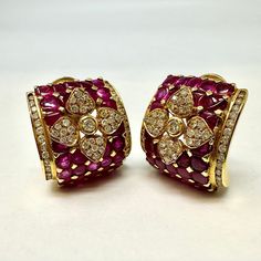 18K Gold Diamond and Ruby Square Clip-on Earrings (includes appraisal, Value: $12,000) Designer = Jewelry Material = 18K Gold Gemstone = Diamond/Ruby Condition = Excellent Class = Premier Location: Wilmette Item Number: 3243-116 Item ID: 270171 Category: Earrings Luxury Multi-stone Diamond Earrings For Formal Occasions, Luxury Multi-stone Earrings For Formal Occasions, Luxury Multi-stone Diamond Earrings, Luxury Multi-stone Diamond Earrings For Anniversary, Luxury Yellow Gold Diamond Earrings With Gemstones, Luxury Diamond Gemstone Earrings For Formal Occasions, Luxury Diamond Earrings With Gemstones For Formal Occasions, Luxury Diamond Gemstone Earrings For Party, Luxury Hand Set Earrings For Evening