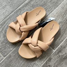 These Lisa Slide Sandals From A New Day Will Have You Ready To Flaunt Your Pretty Pedicure In Fun, Feminine Style. The Flat Sandals With A Square Open-Toe Design, Crisscross Band Upper, Classic Faux-Leather Construction And Memory Foam Insole Give You Distinctive Style And Comfort. The Slip-On Style And Backless Design Give These Medium-Width Slides Comfort And A Breezy Vibe That's Ideal For Everyday Wear. A New Day: Style That Goes Wherever You Do. Trendy Beige Footbed Sandals For Spring, Beige Flat Synthetic Flip Flops, Comfortable Beige Footbed Sandals, Trendy Synthetic Footbed Sandals With Flat Heel, Trendy Flat Heel Synthetic Footbed Sandals, Trendy Synthetic Flat Heel Footbed Sandals, Spring Flat Synthetic Footbed Sandals, Spring Synthetic Flat Footbed Sandals, Trendy Beige Synthetic Sandals